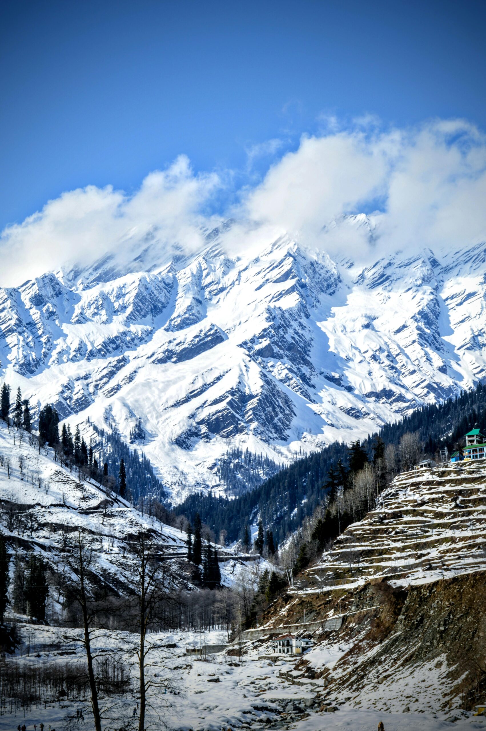 Home Stunning winter landscape of the snow-capped Himalayas near Manali, Himachal Pradesh, India.