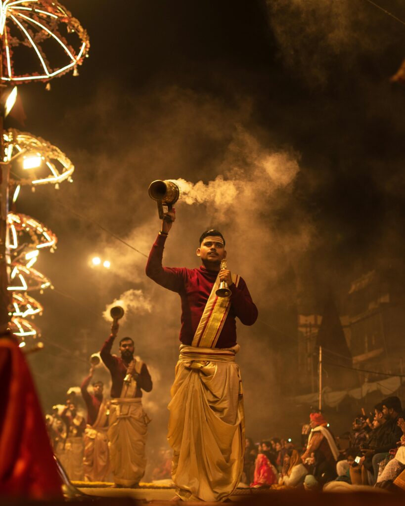 Varanasi Travel Guide: Where Life, Death, and Spirituality Meet Vibrant scene of Ganga Aarti ceremony in Varanasi with priests in traditional attire.