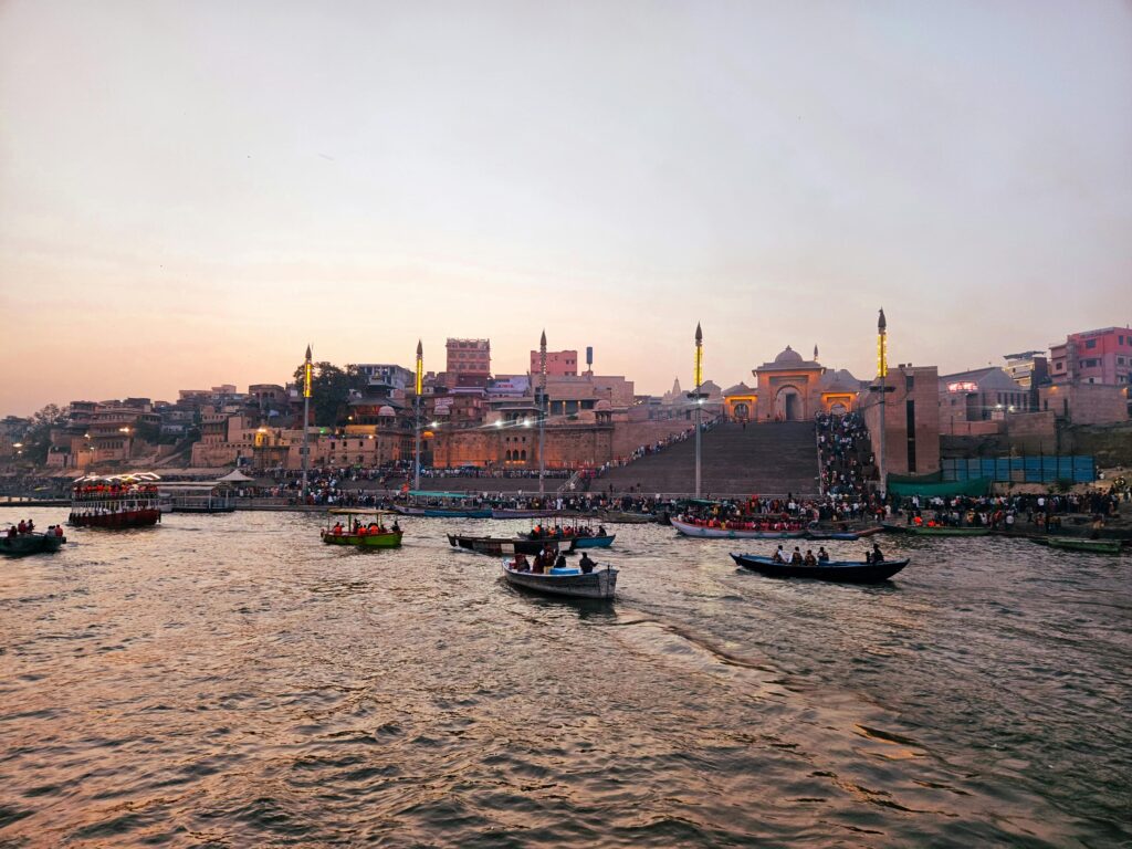 Varanasi Travel Guide: Where Life, Death, and Spirituality Meet Boats on the Ganges River with Varanasi Ghats at sunset, showcasing Indian cultural heritage.