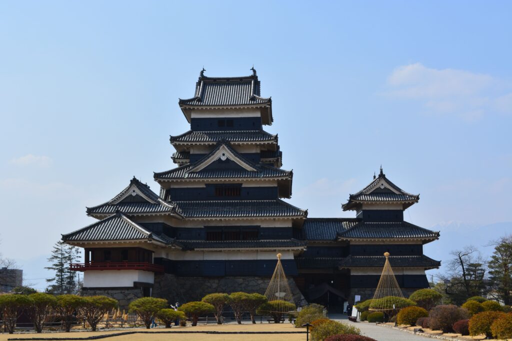 Best Places to Visit in Japan in 2026: 25 Amazing Must-See Gems Stunning view of Matsumoto Castle, a historic Japanese landmark, with clear blue sky.