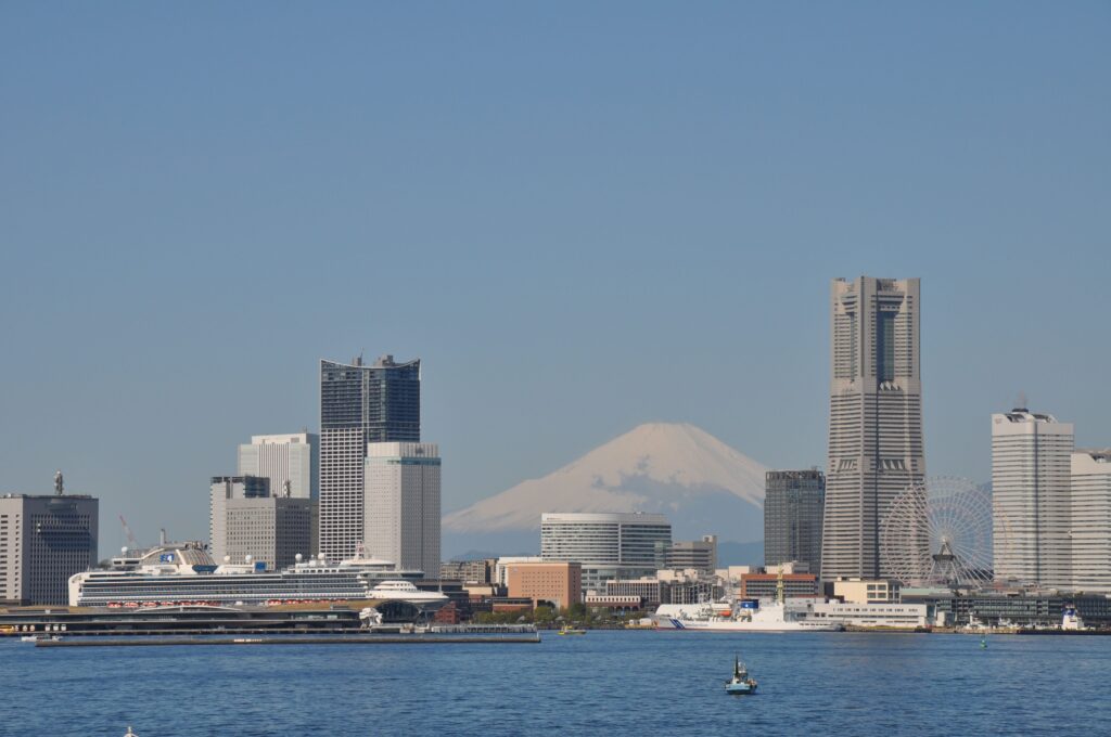 Best Places to Visit in Japan in 2026: 25 Amazing Must-See Gems Stunning view of Yokohama skyline with majestic Mount Fuji in the background.