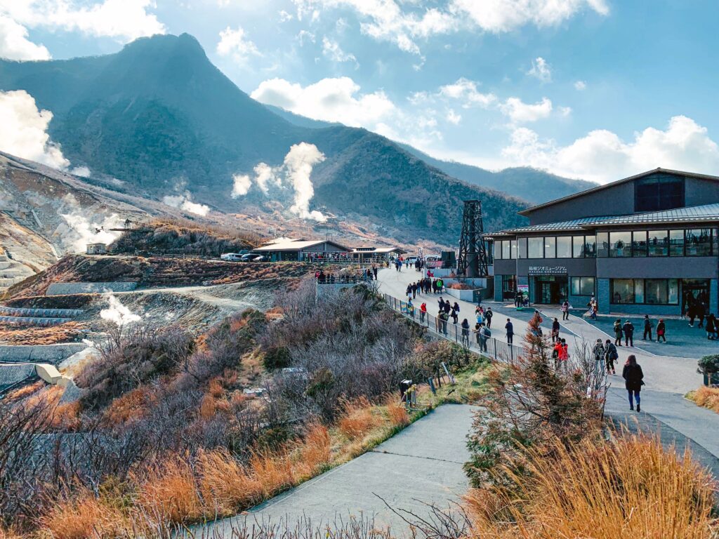 Best Places to Visit in Japan in 2026: 25 Amazing Must-See Gems Amazing landscape of national park with volcanic mountainous terrain with fume mist crowded with tourists and located in Hakone Japan