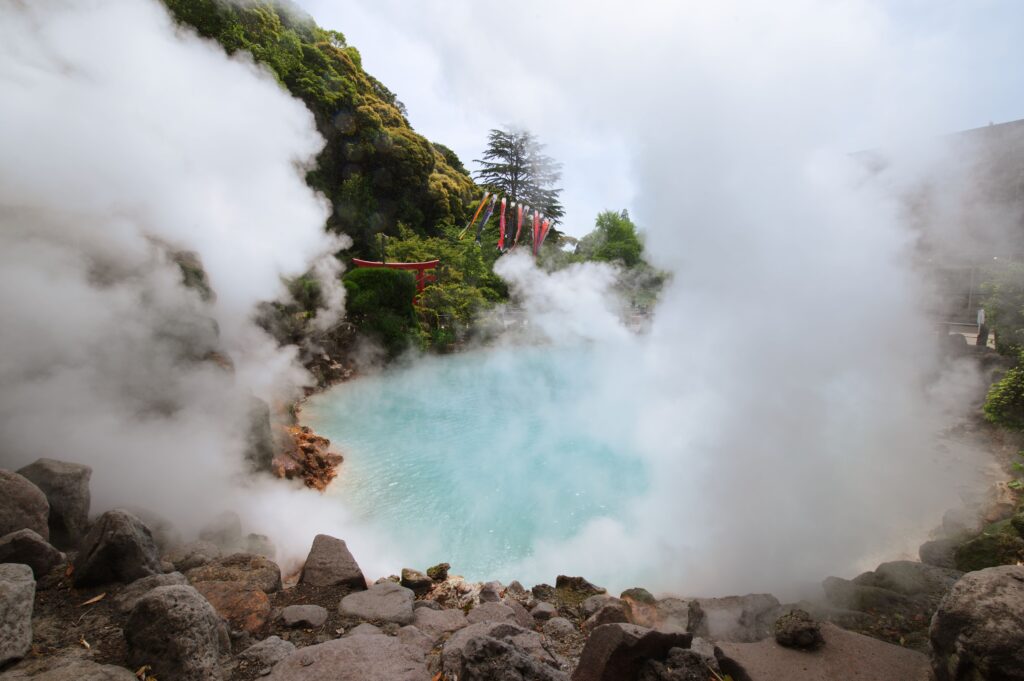 Best Places to Visit in Japan in 2026: 25 Amazing Must-See Gems Geothermal hot spring with steam and rocky surroundings in Beppu, Japan, famous for its hot spring hells.